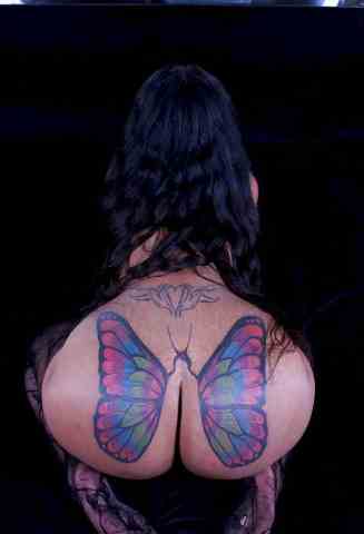 Porn actress with a butterfly on her lower back